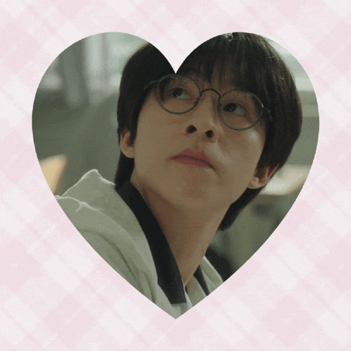a picture of a young man with glasses in a heart