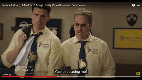two men wearing liberty mutual shirts and ties