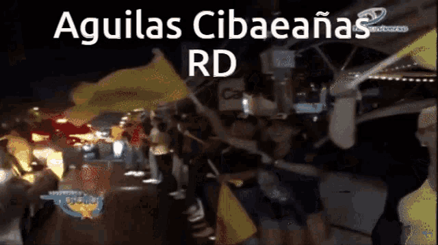 a group of people are standing in front of a sign that says aguilas cibaeanas rd on it
