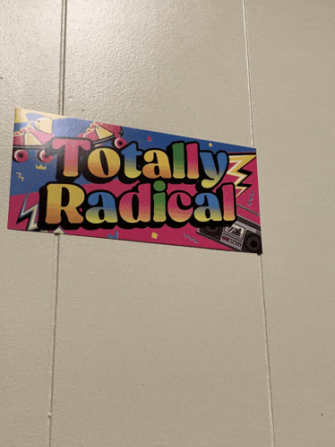 a sign that says totally radical hangs on a white wall