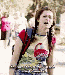 a girl with pigtails and a backpack says no i 'm not dramatic