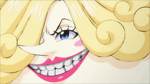 a close up of a woman 's face with a big smile on her face