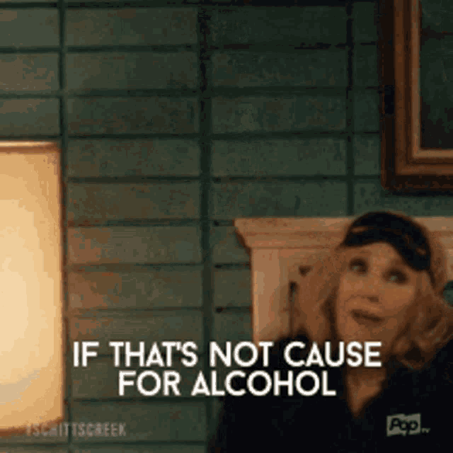 a woman is sitting on a bed and says if that 's not cause for alcohol .