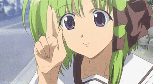 a girl with green hair and purple eyes is making a peace sign with her hand .