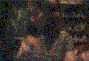 a blurry photo of a woman making a funny face