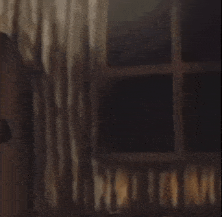 a blurred image of a person in a room