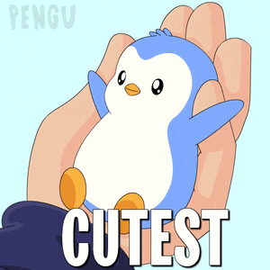 a blue and white penguin is held in a person 's hand with the word cutest written below it