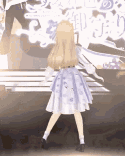 a girl in a purple dress is dancing on a stage in front of a piano .