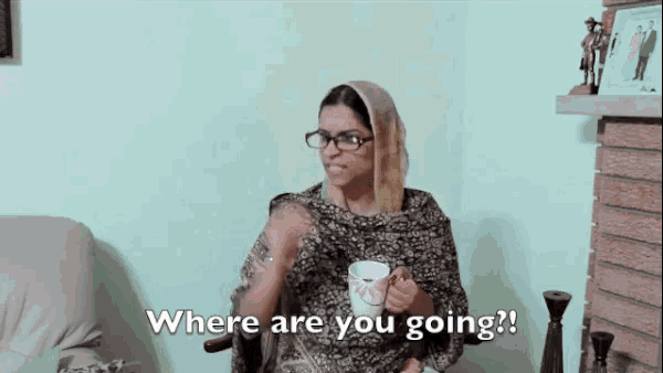 a woman sitting in a chair with a cup in her hand and the words where are you going
