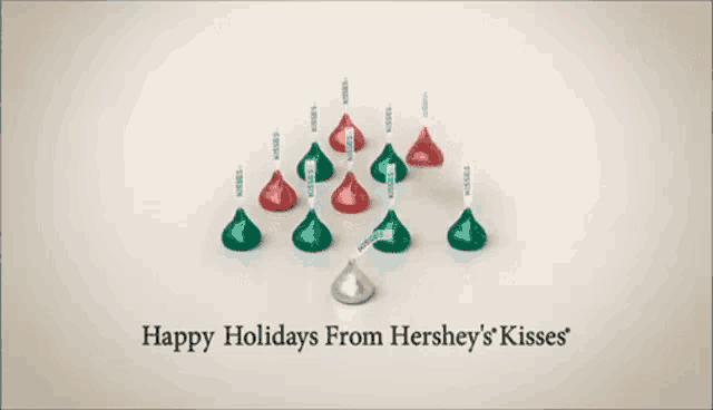 an advertisement for hershey 's kisses says happy holidays