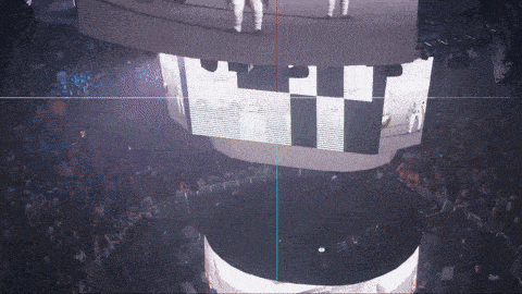 an aerial view of a stadium with a large screen that says pit on it