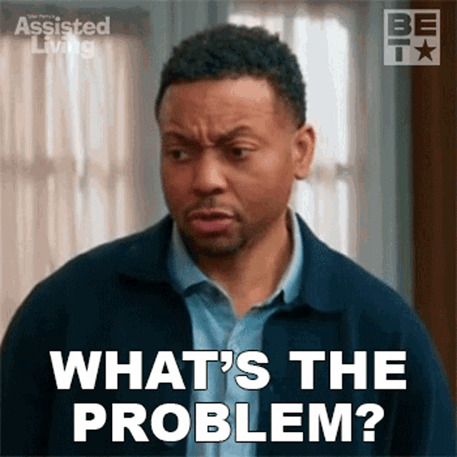 a man is making a funny face and says what 's the problem ?