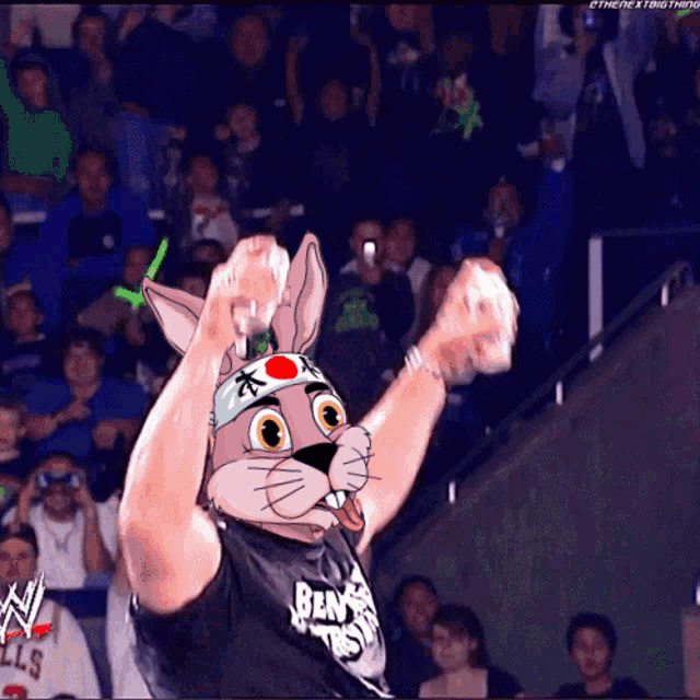 a man wearing a bunny mask and a shirt that says ben is raising his arms in the air