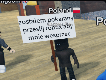 a person is holding a sign that says poland on it