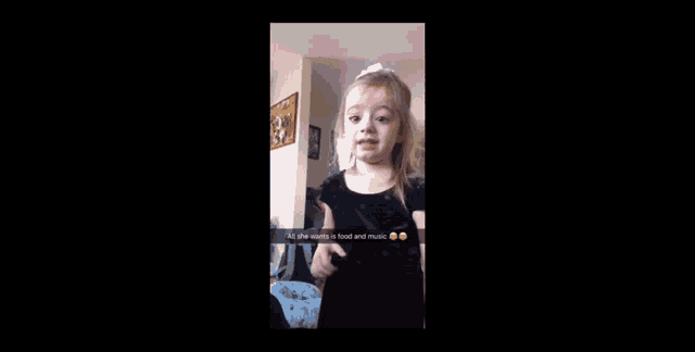 a little girl is making a snapchat with the caption all she wants is food and music .