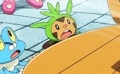 a cartoon character wearing a green hat is laying on the ground