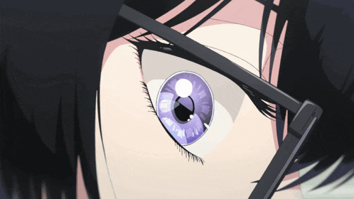 a close up of a person 's eye with a purple iris