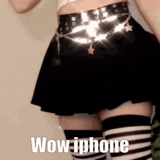 a woman wearing striped thigh high socks and a black skirt says wow iphone on the bottom