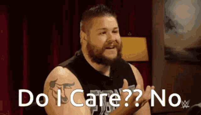 a man with a beard is saying do i care ? no .