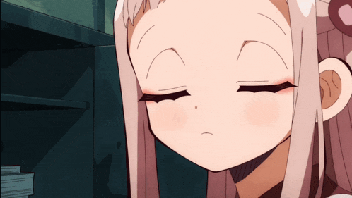 a close up of a cartoon girl with her eyes closed