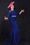 a woman wearing a blue dress and a pink hat is standing in front of a black background .