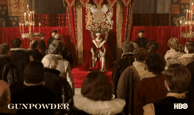 a poster for gunpowder shows a man sitting on a throne in front of a crowd of people