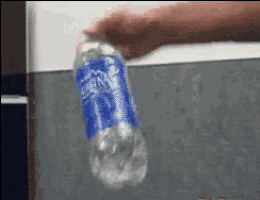 a person is holding a bottle of sierra mist