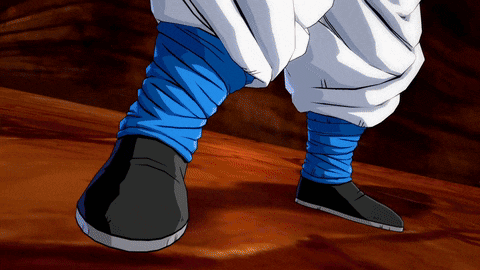 a close up of a person 's feet with blue socks and black shoes