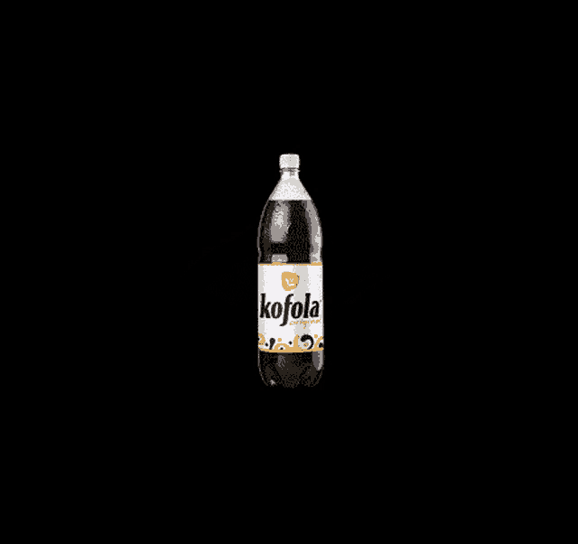 a bottle of kofola original soda with a white label