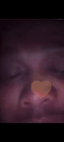 a close up of a person 's face with a purple background