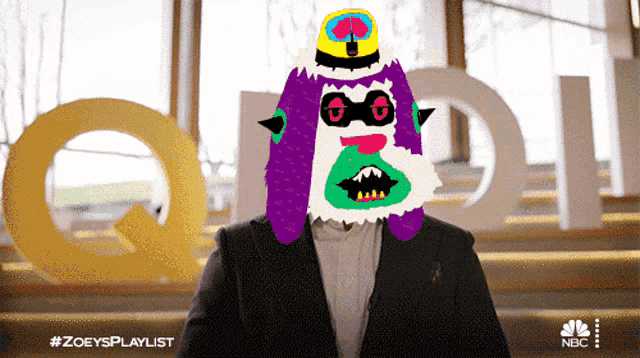 a man in a suit has a colorful monster on his face and the hashtag #zoeysplaylist on the bottom