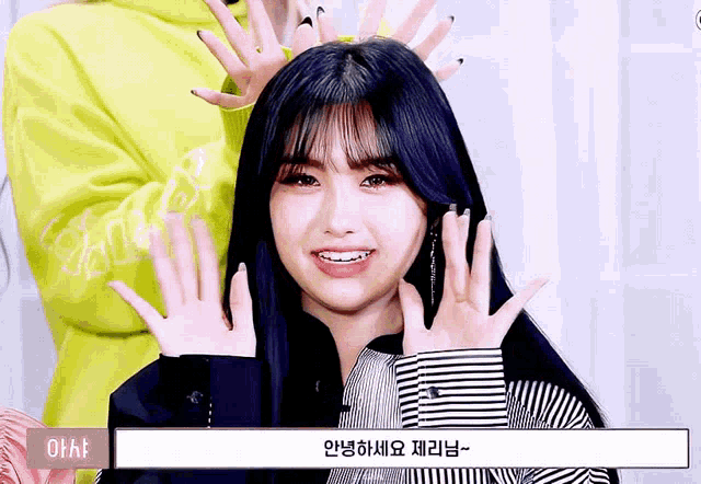 a girl wearing a striped shirt has her hands on her head and the word ohh is visible in the corner