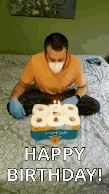 a man wearing a mask is celebrating his birthday with toilet paper rolls