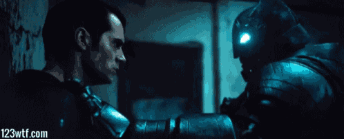 a picture of superman and batman with 123wtf.com in the bottom right corner
