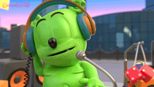 a gummy bear wearing headphones and holding a microphone