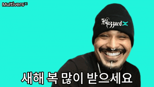 a man wearing a hat with the word blizzard on it is smiling