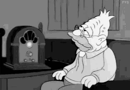 a cartoon character sitting in front of a radio with the letters fys on the bottom