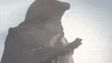 a silhouette of a person in a hooded jacket with their hands together