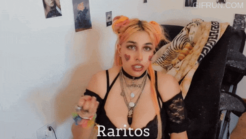 a woman sitting on a bed with the word raritos written on the bottom
