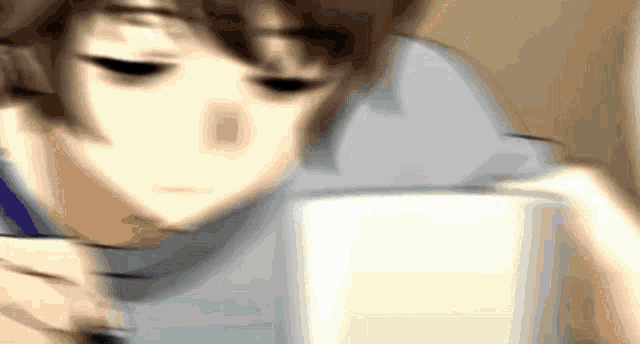 a blurry picture of a person drinking from a white cup