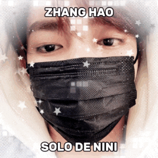zhang hao solo de nini is written on a picture of a person wearing a black face mask