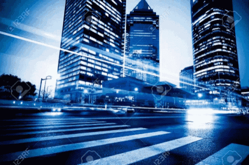 a blurry photo of a city street at night with a crosswalk