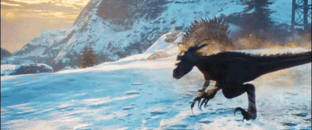 a dinosaur is running in the snow with mountains in the background .