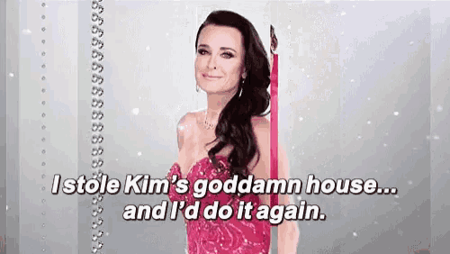 a woman in a pink dress with the words " i stole kim 's goddamn house and i 'd do it again "