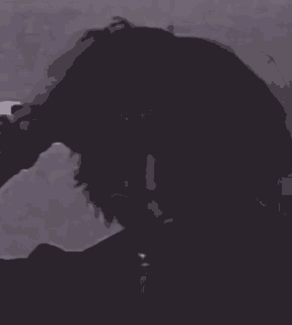 a close up of a person 's face in a black and white photo .