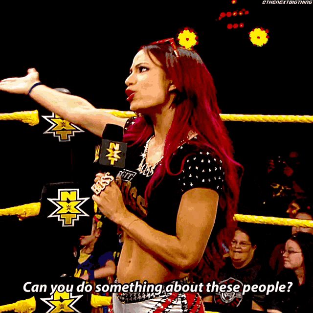 a woman in a wrestling ring talking into a microphone with the words can you do something about these people