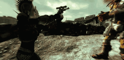 a man with a mohawk is holding a gun