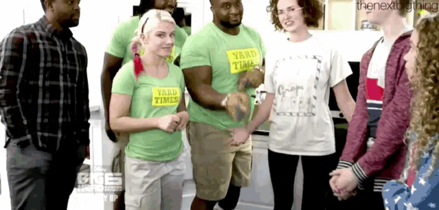 a group of people wearing shirts that say yard times