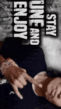 a man laying down with the words " stay one and enjoy " above him