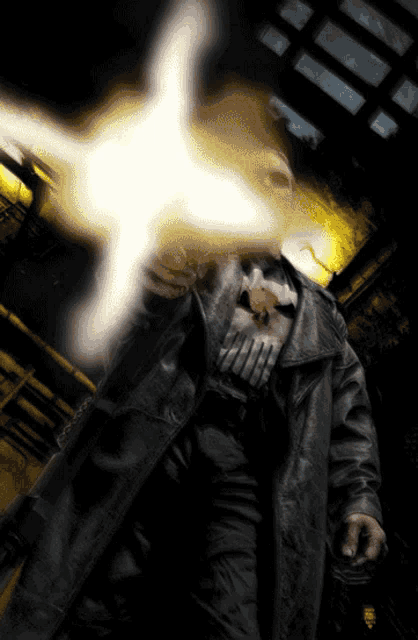 a man wearing a punisher shirt is holding a gun